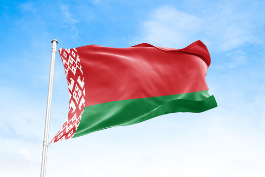 Belarus national flag waving against blue sky