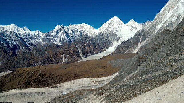 Aerial View of Glacier and Snow Covered Himalayan Peaks During Descent from Larkya La Pass to Bimtang on Manaslu Circuit Trek, Nepal