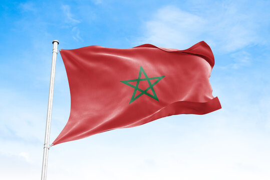Morocco national flag waving against blue sky