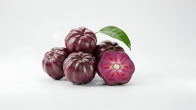 Ripe Star Apples with a single green leaf during studio lighting for healthy eating concepts
