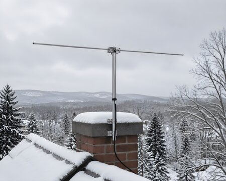Dipole Antenna On Residential Roof Near Chimney With Beautiful Snowy Winter Background Seasonal Scene Photograph