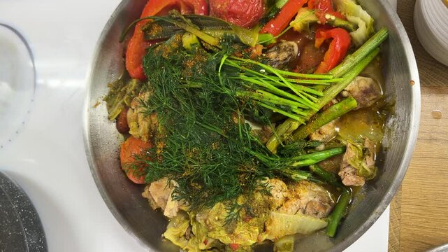 A dish of stewed vegetables in a frying pan. Selective focus.