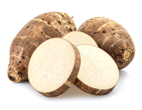 Fresh Brown Taro Roots and Sliced Taro Displayed on White Background