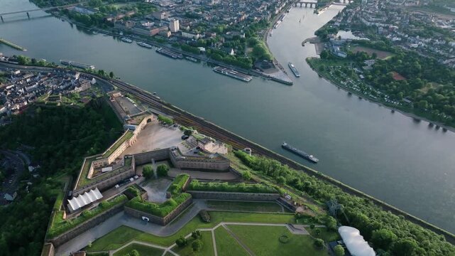 Ehrenbreitstein Fortress in Coblenz, View on Deutsches Eck or German Corner in Koblenz, Germany. Mosel river joins Rhine