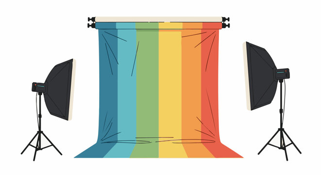 Studio backdrop setup with softbox lights on tripods, rainbow colored fabric