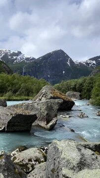 Huge stones in a river among the mountains