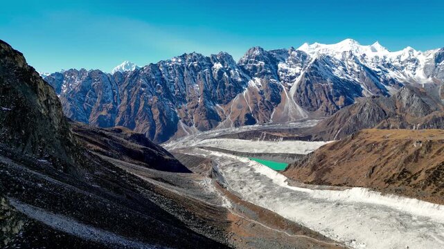 Aerial View of Glacier Lake and Himalayan Peaks During Descent from Larkya La Pass to Bimtang on the Manaslu Circuit Trek, Nepal