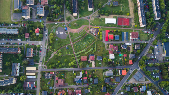 Top down aerial view of a public park and residential district with apartment blocks and houses in Czechowice-Dziedzice, Silesia, Poland