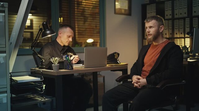 Police detective interrogating a possible suspect during an investigation