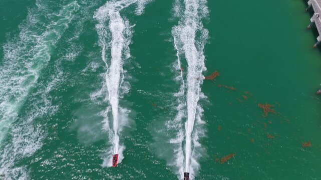 Beach life concept. Vacation on summer. Aerial view at vacation. Jet ski in motion. Summer vacation activity. Water sport activity in summer. Sea beach lifestyle