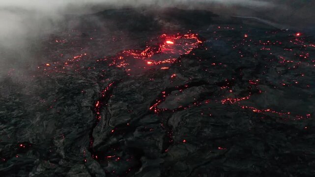 Aerial Drone View of Active Lava Channels and Glowing Hot Spots at Night, Geldingadalir Volcano Iceland
