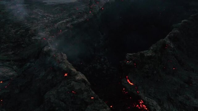 Low Altitude Aerial Drone Flight Over Active Lava Flow Field with Glowing Embers, Geldingadalir Iceland