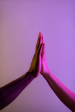 Multiracial couple high five