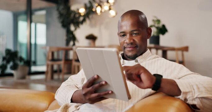 Man, scroll and relax with tablet in home, online and streaming movies with subscription on website. Happy, black person and watching film with tech, browsing and smile with entertainment in lounge
