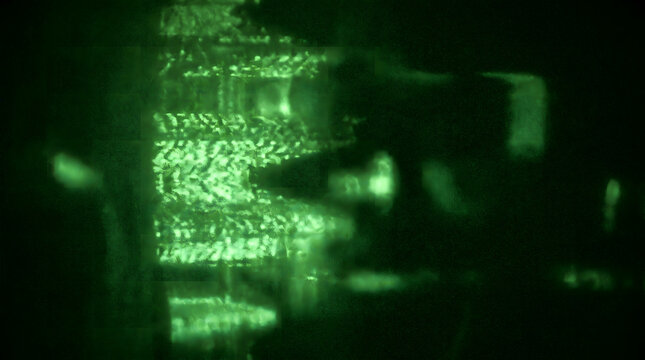 Abstract green night vision static texture background with blurred surveillance and digital noise