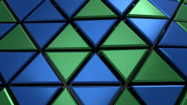 Seamless blue and green triangular geometric pattern background with a three dimensional effect.