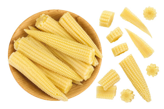 Pickled young baby corn cobs in wooden bowl isolated on white background Top view. Flat lay