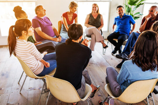 Support group meeting with diverse people in a circle