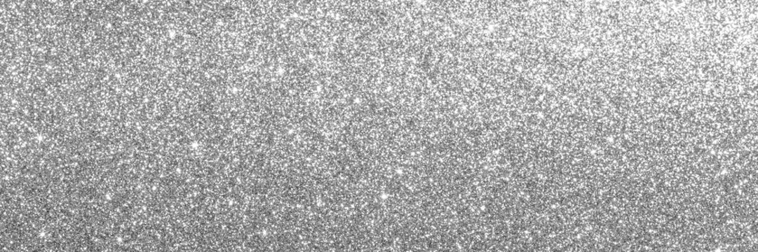 Silver glitter background with sparkling metallic texture and bokeh shimmer for festive design