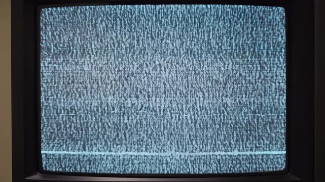 Vintage television with static noise transitioning between frames