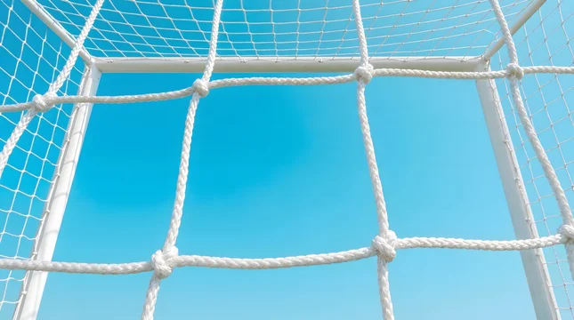 Soccer Goal Net Against Clear Blue Sky.