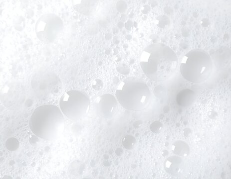 Close-up view of a frothy, white soap suds.  Bubbles of various sizes are visible