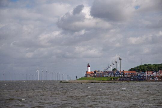 Wind turbines stretching out over the skyline of Urk