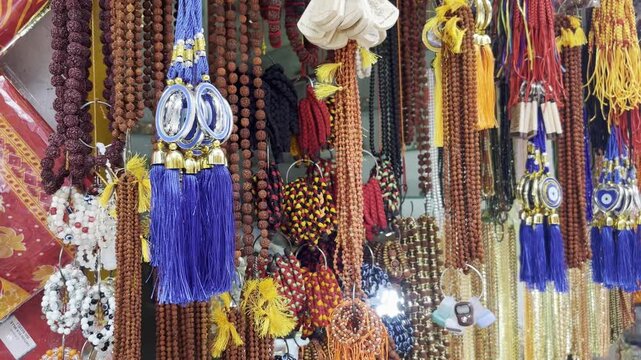 Street market shops colored necklaces , door hanging ring, key rings in kamakhya temple 