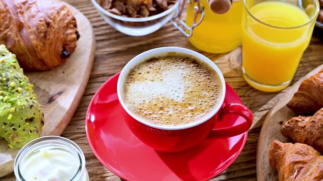 Italian breakfast served with croissants, orange juice, coffee and sweet extrass.