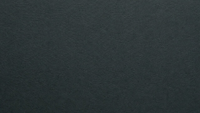 Dark gray textured background, solid color with subtle grain pattern.

