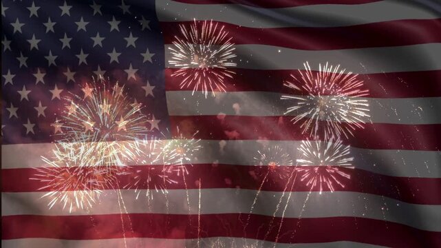 Multiple bright fireworks burst across a darkened, waving American flag. The animated overlay creates a festive, patriotic mood perfect for national holidays.