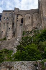Obraz premium Architecture and buildings of Mont-Saint-Michel interior, medieval Gothic and Romanesque architecture, historic stone walls, columns, details. UNESCO heritage monument in Normandy, France