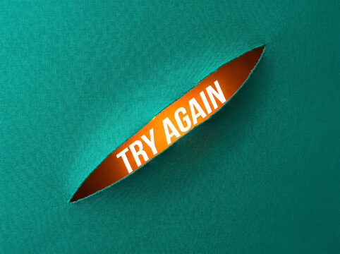 The 'Try Again' message is revealed through torn paper, resilience, persistence, growth mindset, overcoming failure and continuous improvement concept