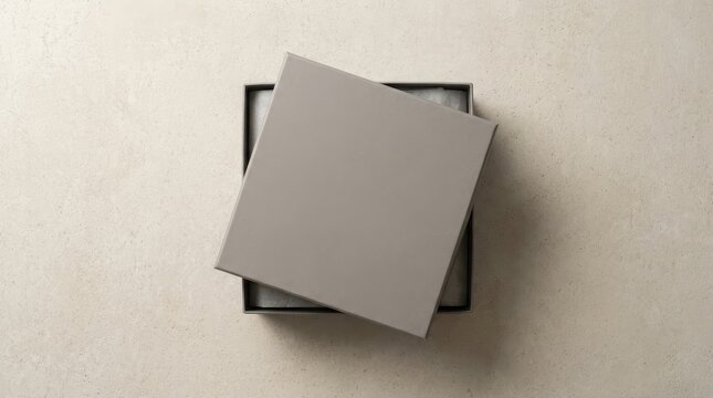 A sleek grey box with its lid slightly open for presentation