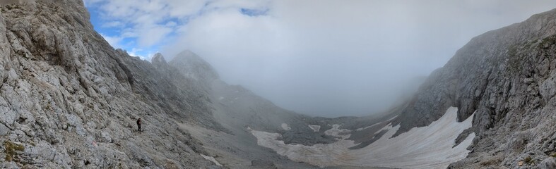 Panoramic view of Logarska dolina valley with peaks of Slovenian Alps covered by passing clouds. © Semi