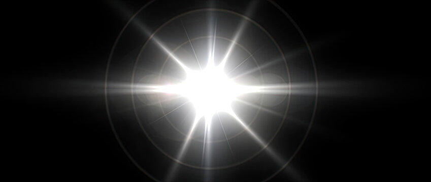 Bright Starburst Lens Flare Effect on Black Background.