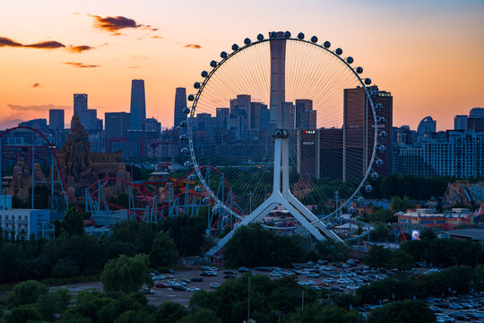 Beijing Happy Valley Ferris Wheel at Sunset with CBD Skyline