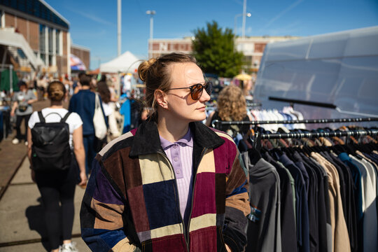 Browsing clothes at flea market