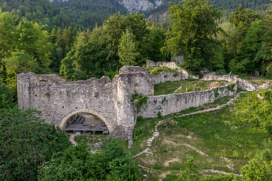 Close view of medieval Burgruine Thaur castle ruin with arched gateway, wall sections and ramparts in Tyrol, Austria