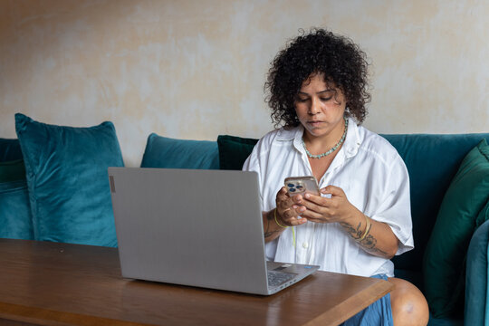 focused woman using smartphone, answering email