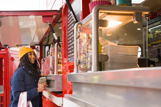 Woman Orders Food at Food Truck in Liverpool, UK