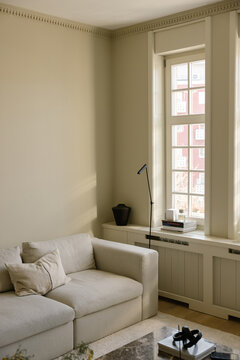 Living Room With Modern Furniture and Large Windows in a House