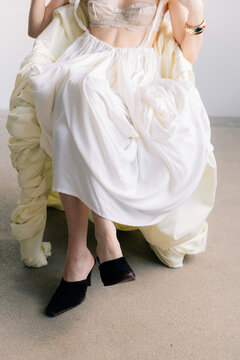 Couture fashion detail with sculptural white draping