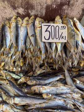 Dried fish with a price tag at a public market stall