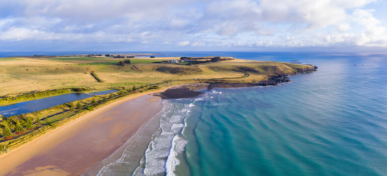 Early Morning Aerial flyover Godfreys Beach Tasmania  