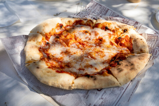  Freshly Baked Pizza Served Outdoors.