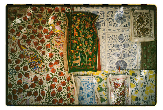 Traditional Uzbek textiles and ceramics at a market stall