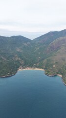 Fototapeta premium Aerial View of Pouso da Cajaíba Beach and Atlantic Forest, Brazil | Vista Aérea da Praia do Pouso da Cajaíba e Mata Atlântica, Brasil