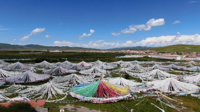 Vast Tibetan Prayer Flag Field on the Tibetan Plateau Near Mountain Town