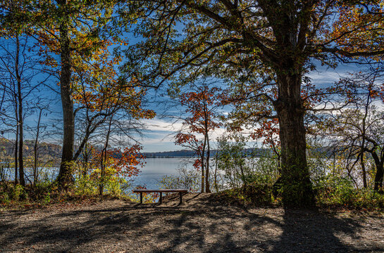 park bench over looking a lake 